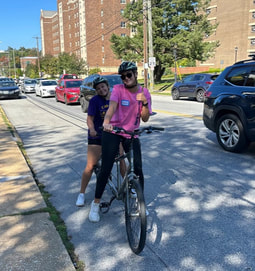 Karlee pilots a tandem bike with Hannah as the stoker. 