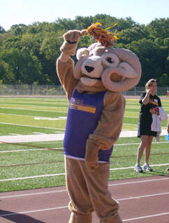 Picture of the WCU mascot Rammy the ram wearing a camp shirt. 